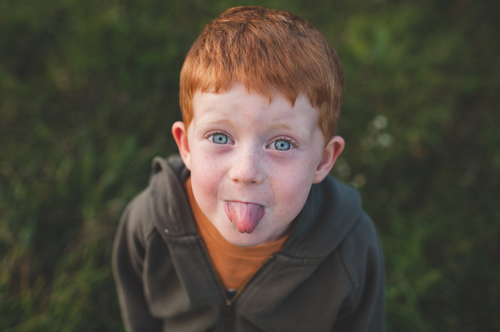 Little boy with blue eye and red hair